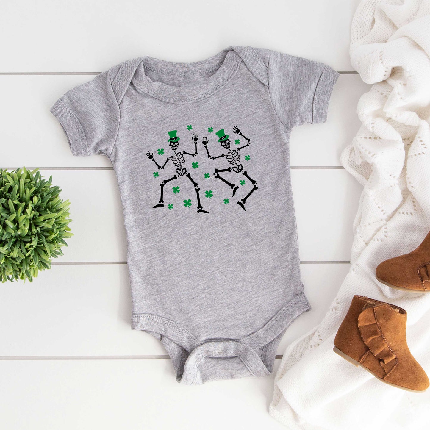 Shamrocks And Dancing Skeletons | Baby Graphic Short Sleeve Onesie