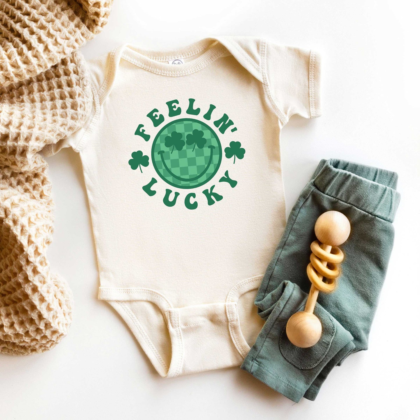 Feelin' Lucky Checkered Smiley Face | Baby Graphic Short Sleeve Onesie