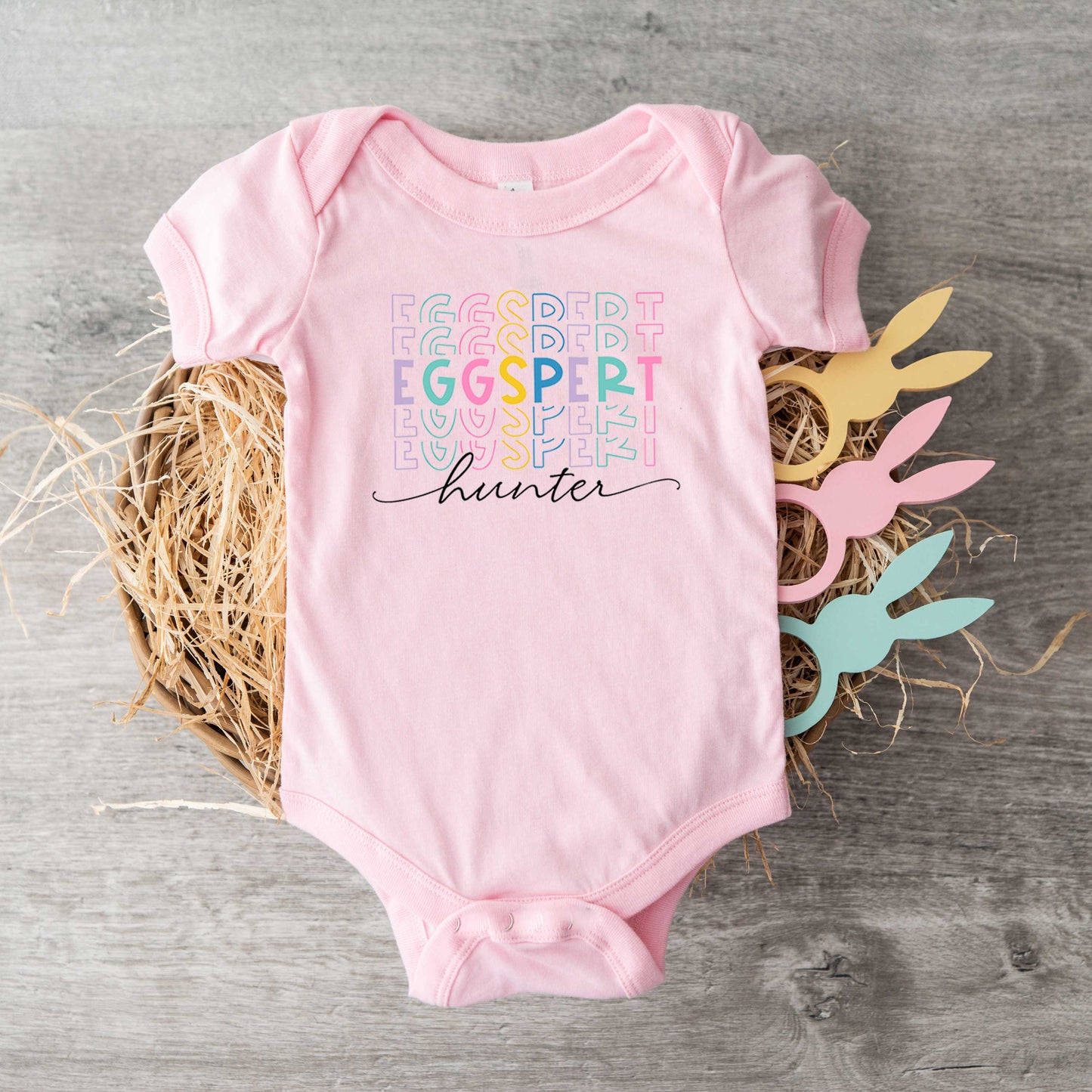 Eggspert Hunter Stacked | Baby Graphic Short Sleeve Onesie