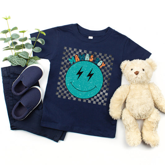 Mama's Boy Checkered Smiley Face | Toddler Short Sleeve Crew Neck