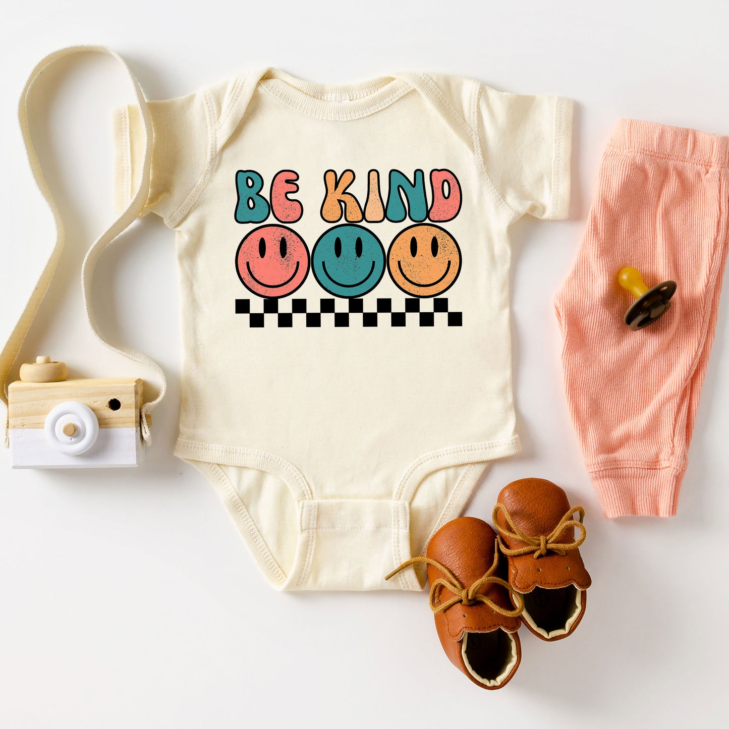 Checkered Be Kind Smiley Face | Baby Graphic Short Sleeve Onesie