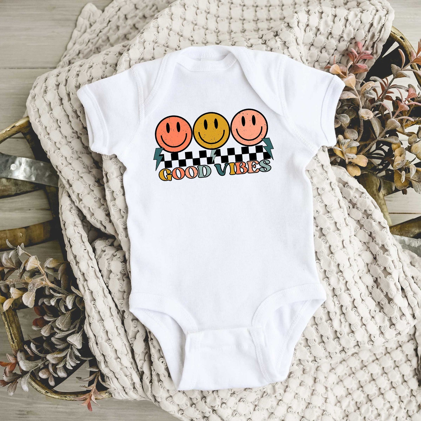 Checkered Good Vibes Smiley Face | Baby Graphic Short Sleeve Onesie